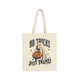 An off-white canvas tote bag with a Halloween graphic that reads 'NO TRICKS JUST TREATS' in black lettering, featuring a cartoon ghost, a pumpkin, and bats.