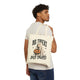 Person holding a tote bag with "No tricks, just treats" graphic of a dog wearing a ghost costume and holding a Halloween pumpkin. 
